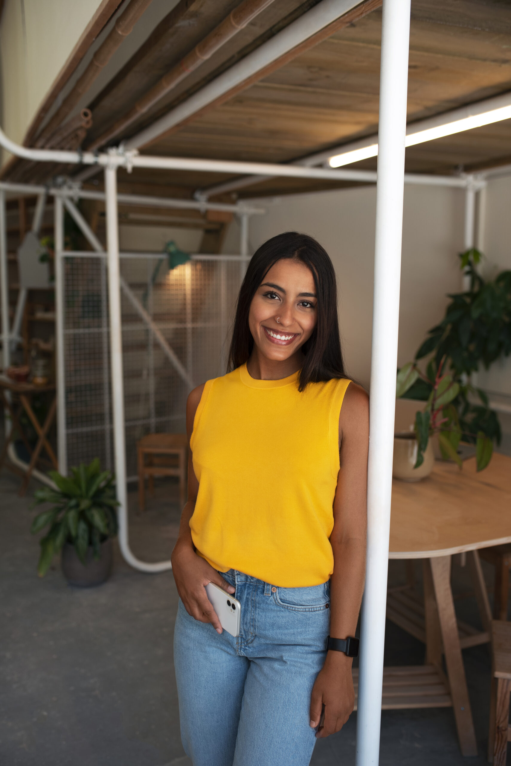 front-view-smiley-arab-woman-posing-indoors